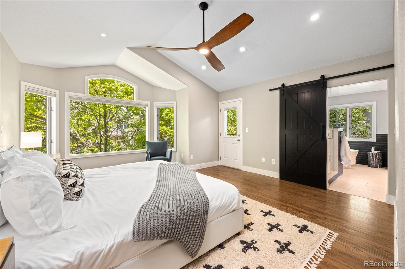 4141 South Hampton Circle Boulder, CO 80301 - Photo 14 of 35 a spacious bedroom with a bed and a large window
