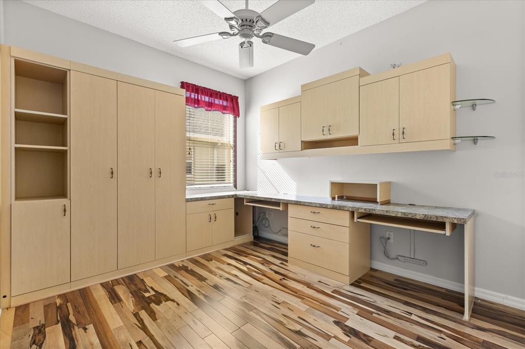 1424 Irwin Way The Villages, FL 32162 - Photo 20 of 28 a kitchen with granite countertop white cabinets and white appliances