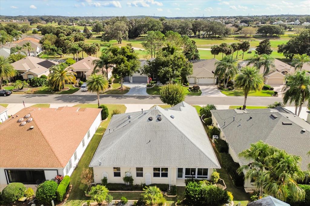 1424 Irwin Way The Villages, FL 32162 - Photo 2 of 28 an aerial view of residential houses with outdoor space and swimming pool