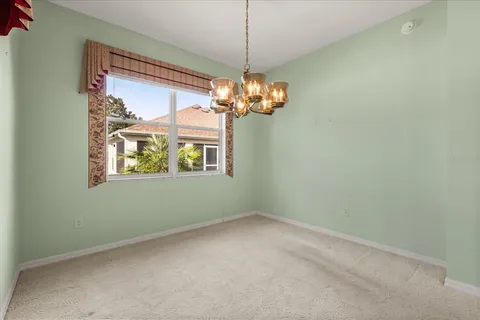 a view of livingroom with window and chandelier