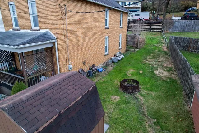 a backyard of a house with lots of green space
