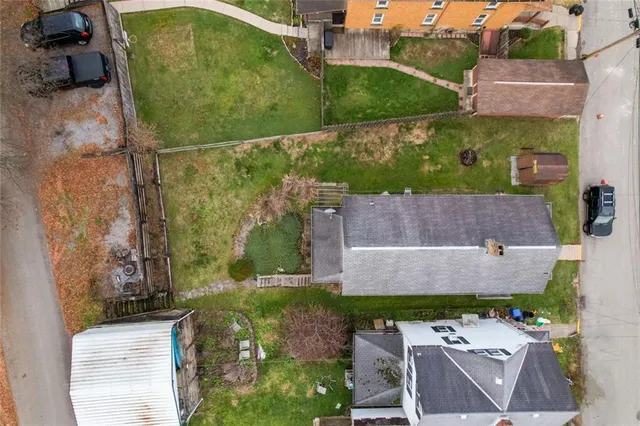 an aerial view of a house with a garden