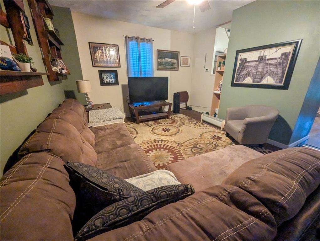 29 Main Street Freeport, PA 16229 - Photo 20 of 34 a living room with furniture and a flat screen tv