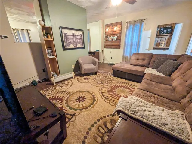 a living room with furniture and a window