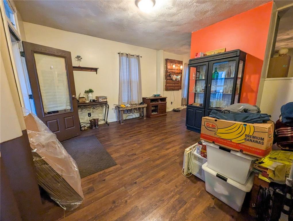 29 Main Street Freeport, PA 16229 - Photo 25 of 34 a living room with furniture a fireplace and large windows
