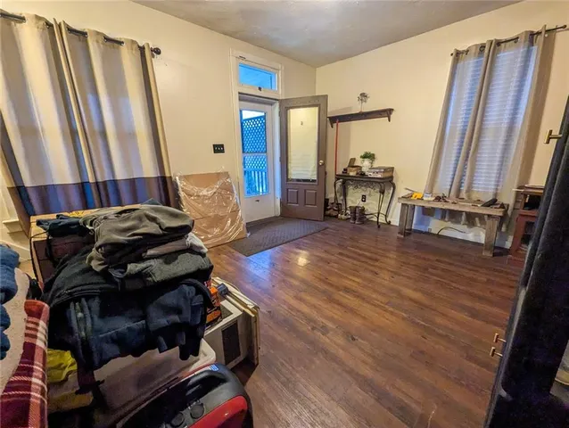 a living room with furniture and a mirror