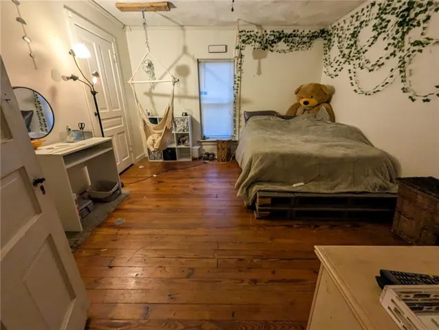 a bedroom with table and chairs