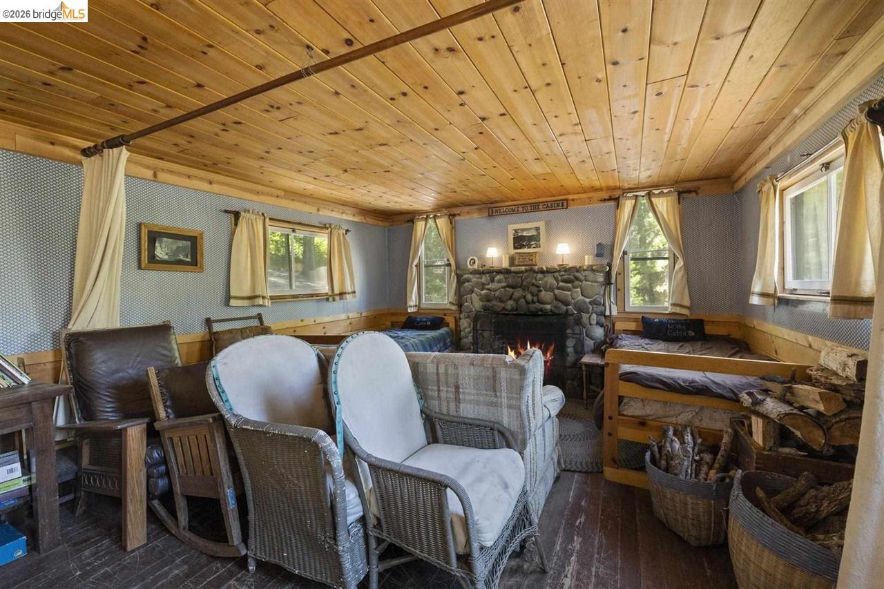 7 Riverside Tract Kyburz, CA 95720 - Photo 10 of 25 a living room with furniture and a fireplace