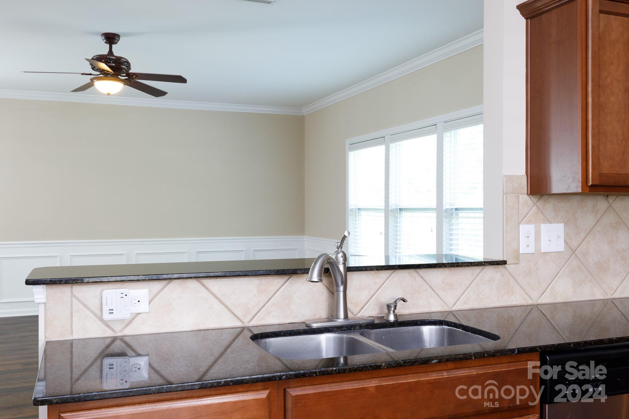 2219 Bluebell Way Fort Mill, SC 29708 - Photo 12 of 48 a kitchen with a sink and a window