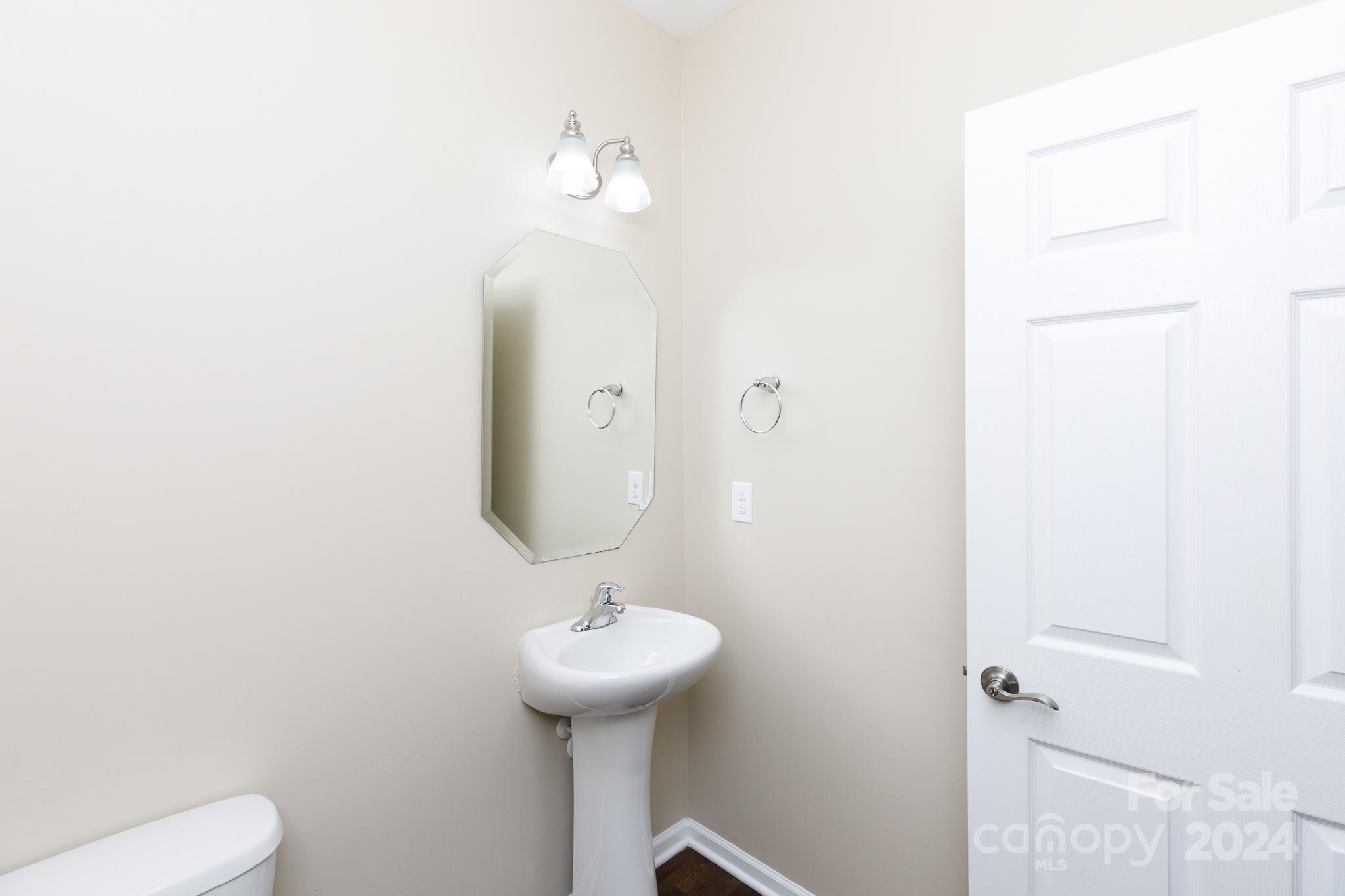 2219 Bluebell Way Fort Mill, SC 29708 - Photo 16 of 48 a bathroom with a sink and mirror with toilet