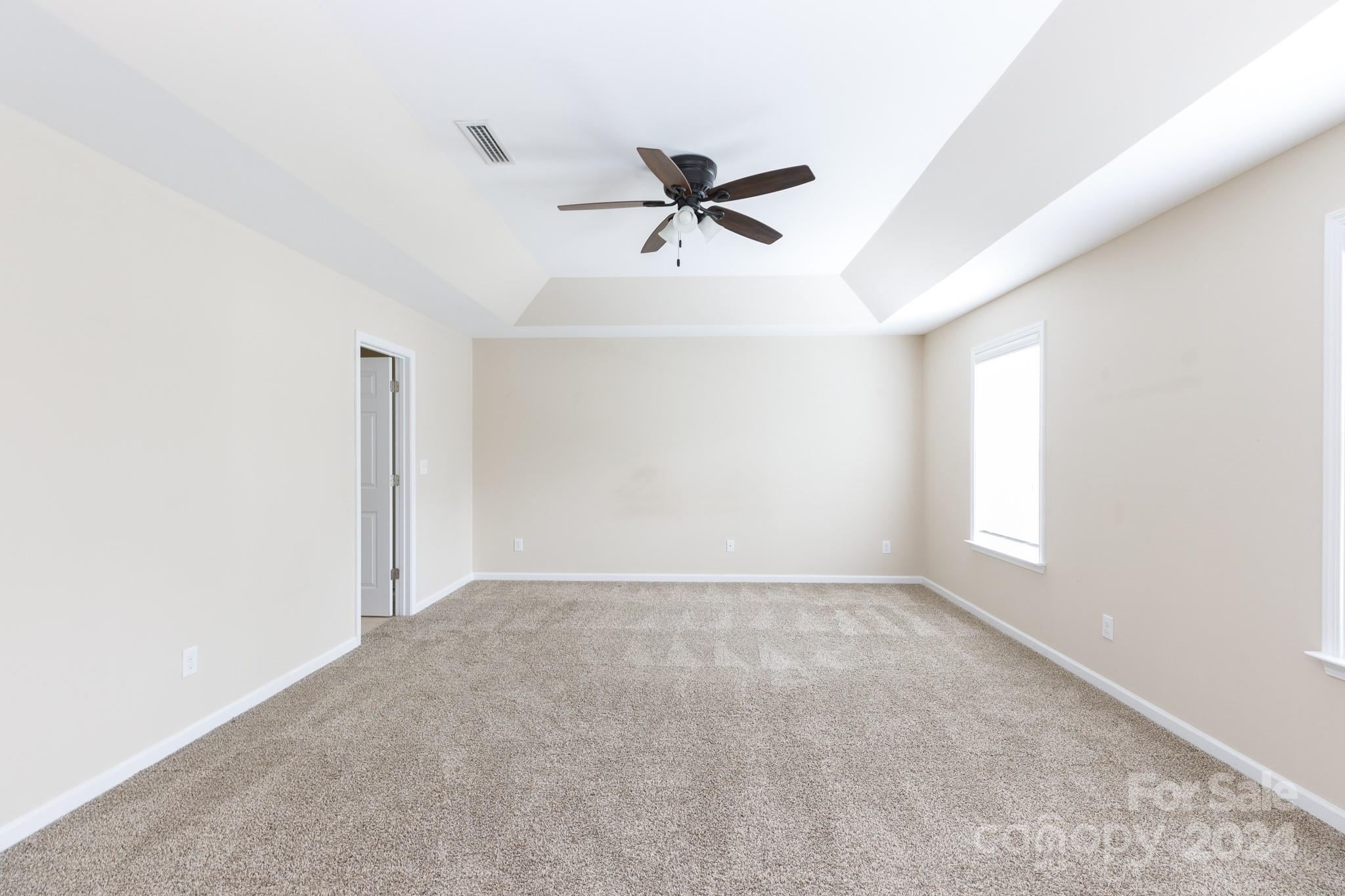 2219 Bluebell Way Fort Mill, SC 29708 - Photo 25 of 48 a view of a room with a ceiling fan and window