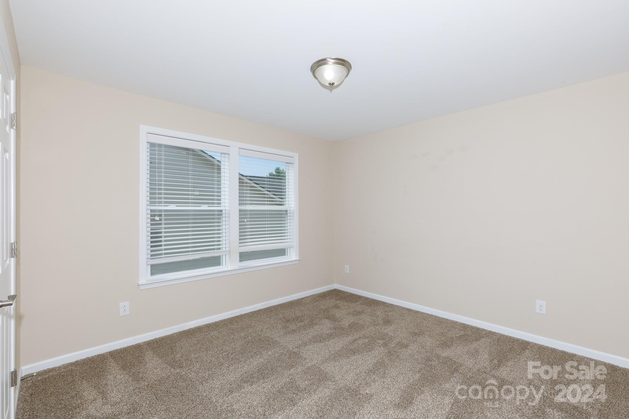 2219 Bluebell Way Fort Mill, SC 29708 - Photo 27 of 48 an empty room with a window