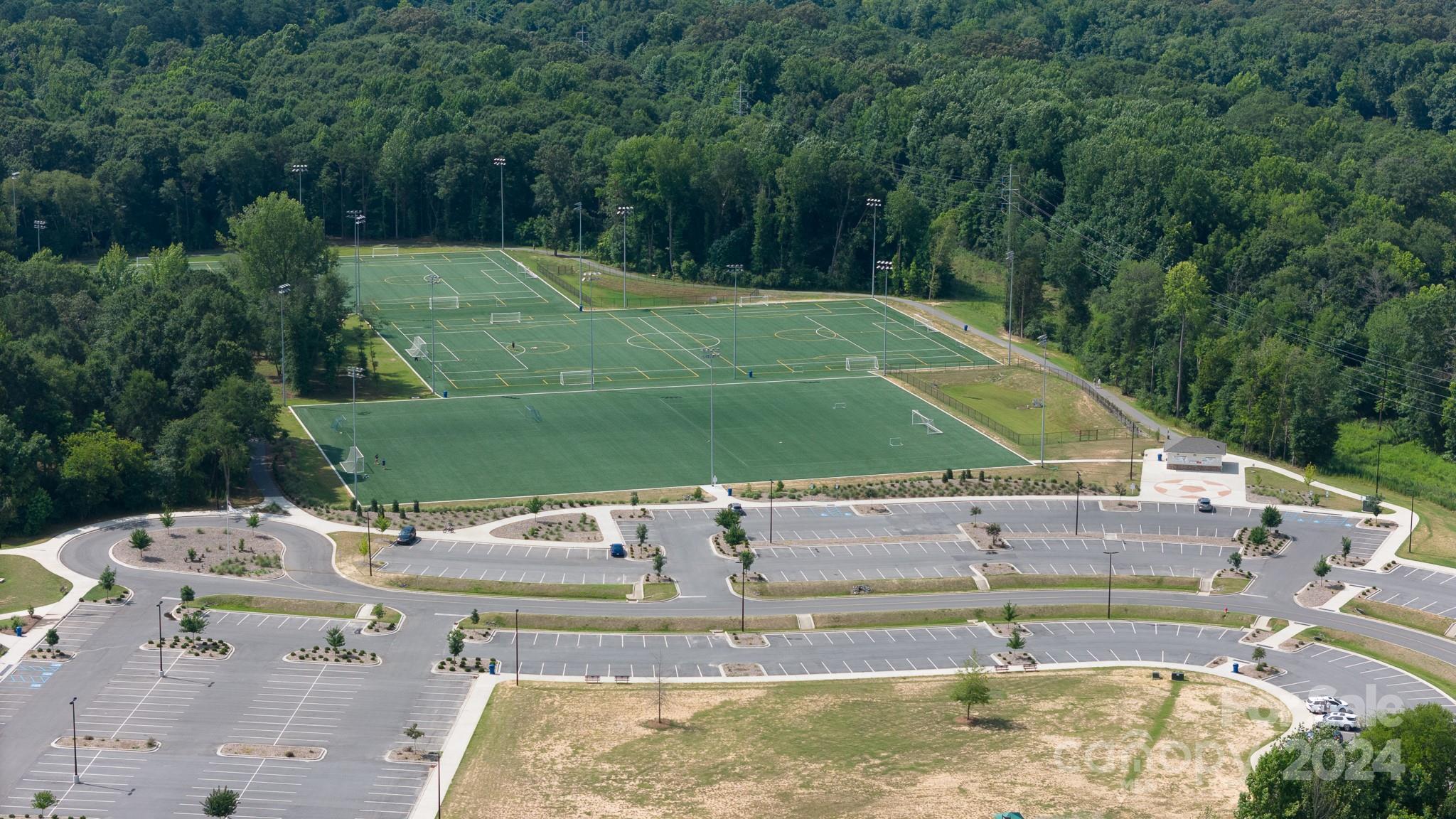 2219 Bluebell Way Fort Mill, SC 29708 - Photo 46 of 48 a view of a swimming pool with a yard