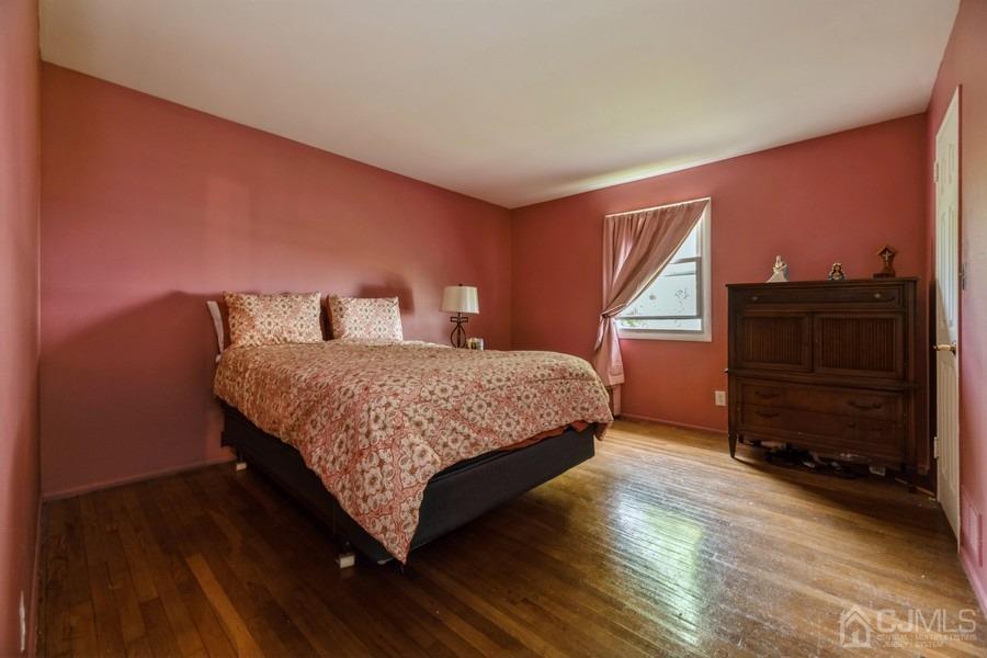 197 Princeton Road Old Bridge, NJ 08859 - Photo 12 of 25 a bedroom with a bed and a dresser
