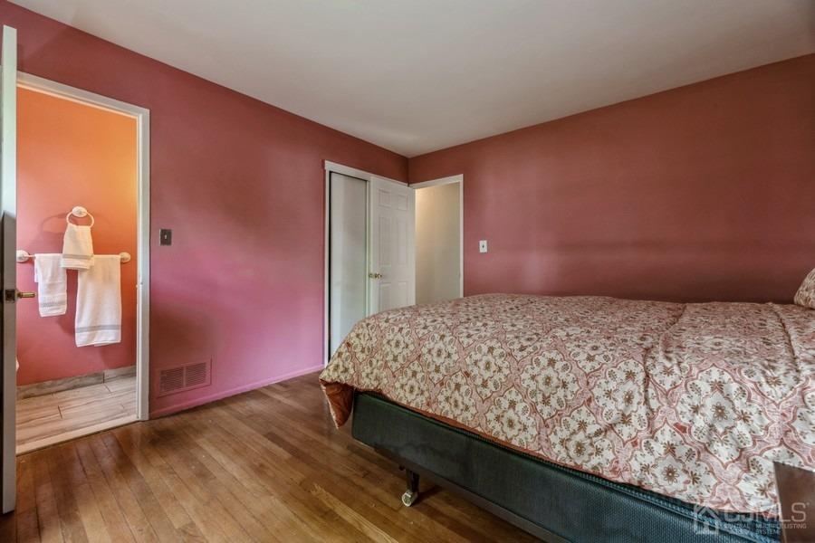 197 Princeton Road Old Bridge, NJ 08859 - Photo 13 of 25 a bedroom with a bed and wooden floor
