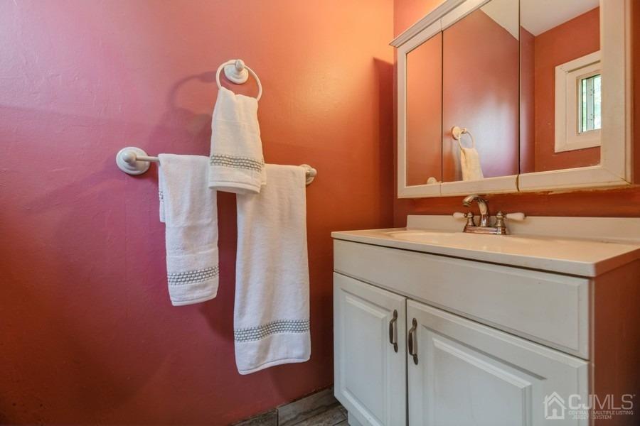 197 Princeton Road Old Bridge, NJ 08859 - Photo 14 of 25 a bathroom with a sink vanity and mirror
