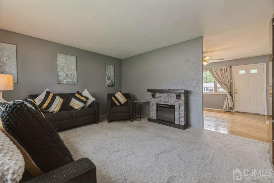 197 Princeton Road Old Bridge, NJ 08859 - Photo 10 of 25 a living room with furniture and a fireplace