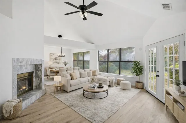 a living room with furniture and a fireplace