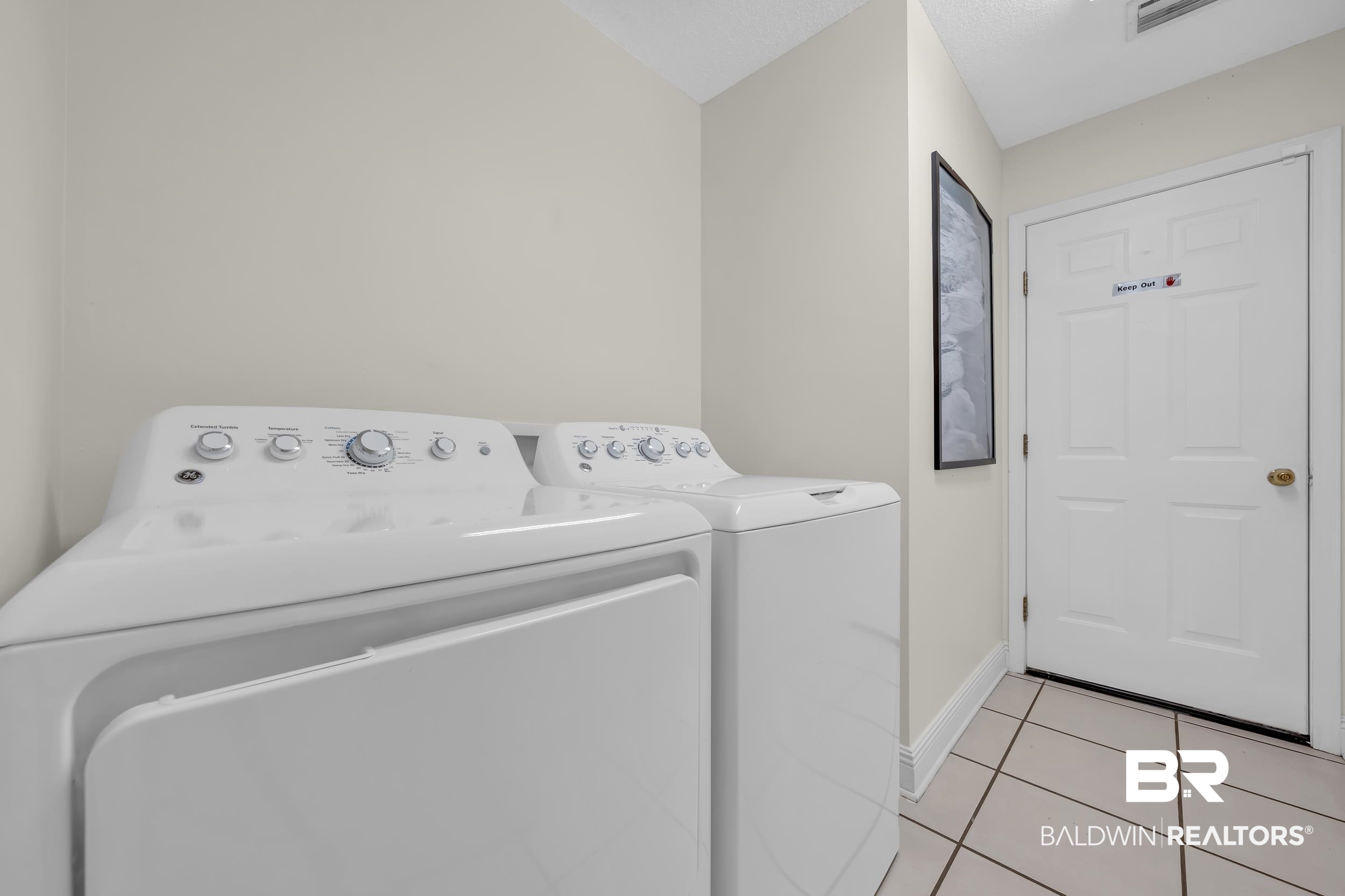 509 Loblolly Court Foley, AL 36535 - Photo 21 of 26 Dedicated laundry area featuring a white top-load washer and dryer, neutral wall paint, and ceramic tile flooring