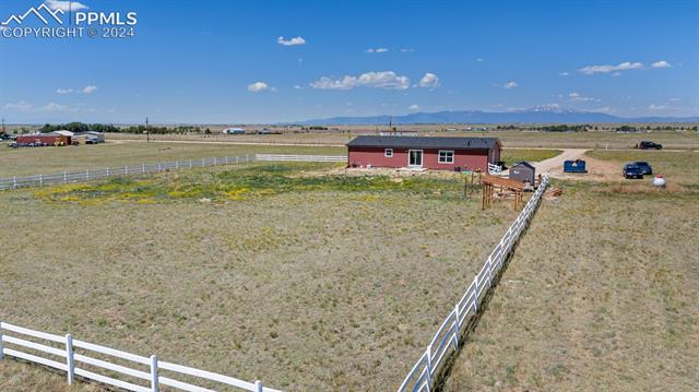 5929 North Log Road Calhan, CO 80808 - Photo 35 of 41 View of yard featuring a mountain view