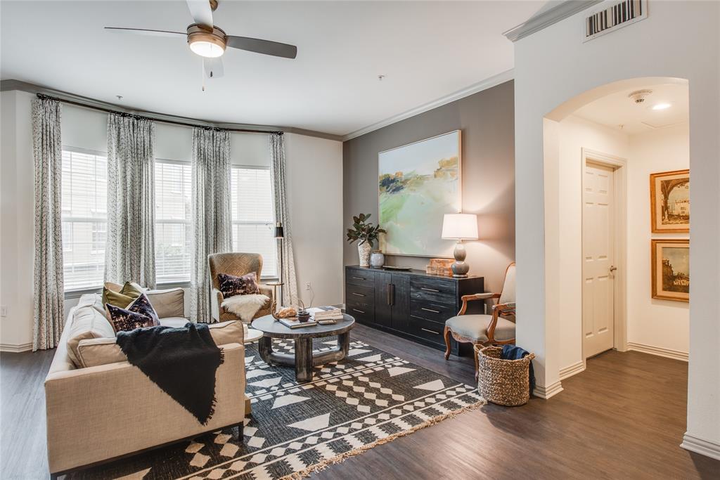 4201 Lomo Alto Drive, Unit 216 Highland Park, TX 75219 - Photo 2 of 31 a living room with furniture and a large window