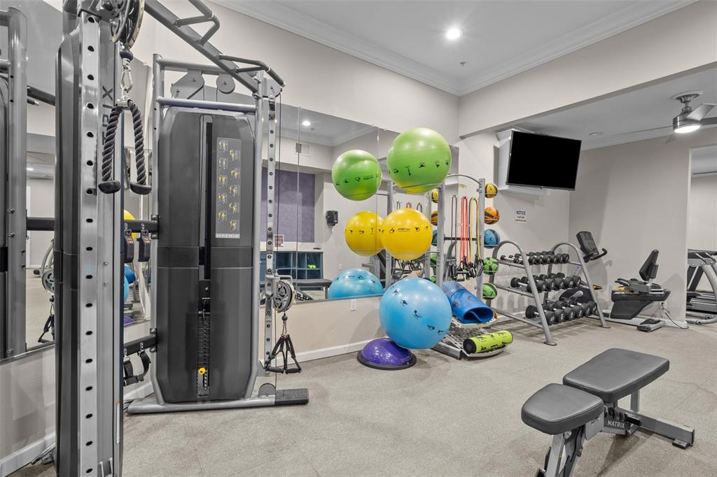4201 Lomo Alto Drive, Unit 216 Highland Park, TX 75219 - Photo 21 of 31 a view of a room with gym equipment
