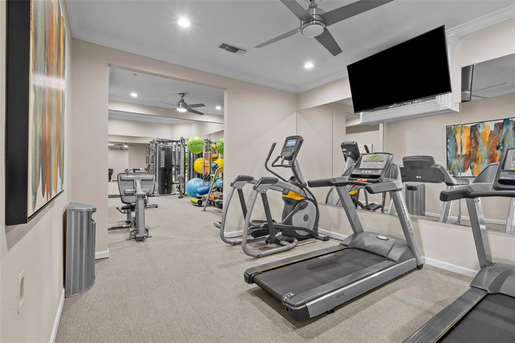 4201 Lomo Alto Drive, Unit 216 Highland Park, TX 75219 - Photo 22 of 31 a view of a room with gym equipment