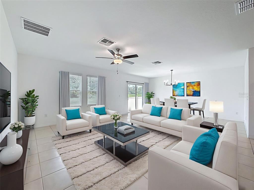 4395 Trotters Way Lakeland, FL 33801 - Photo 13 of 67 a living room with furniture and a chandelier