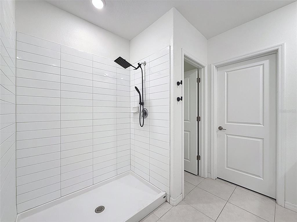 4395 Trotters Way Lakeland, FL 33801 - Photo 19 of 67 a bathroom with a shower