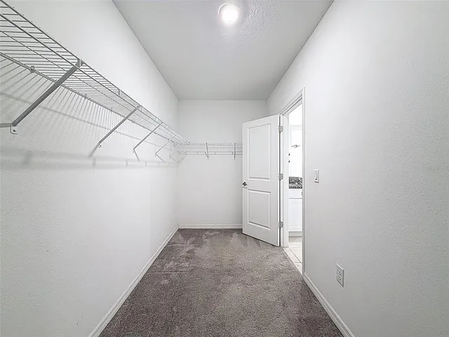 a bathroom with a granite countertop sink toilet mirror and bathtub