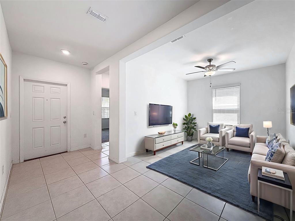 4395 Trotters Way Lakeland, FL 33801 - Photo 22 of 67 a living room with furniture and a flat screen tv