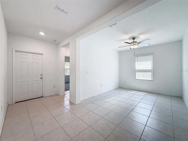 a view of a big room with windows and cabinet