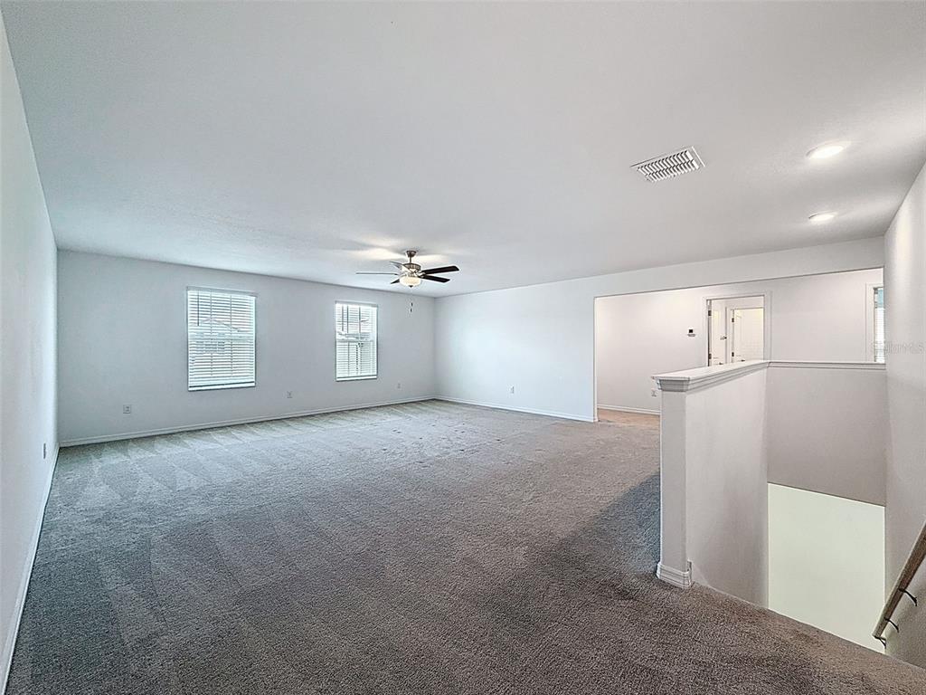4395 Trotters Way Lakeland, FL 33801 - Photo 31 of 67 a view of a big room with windows and cabinet