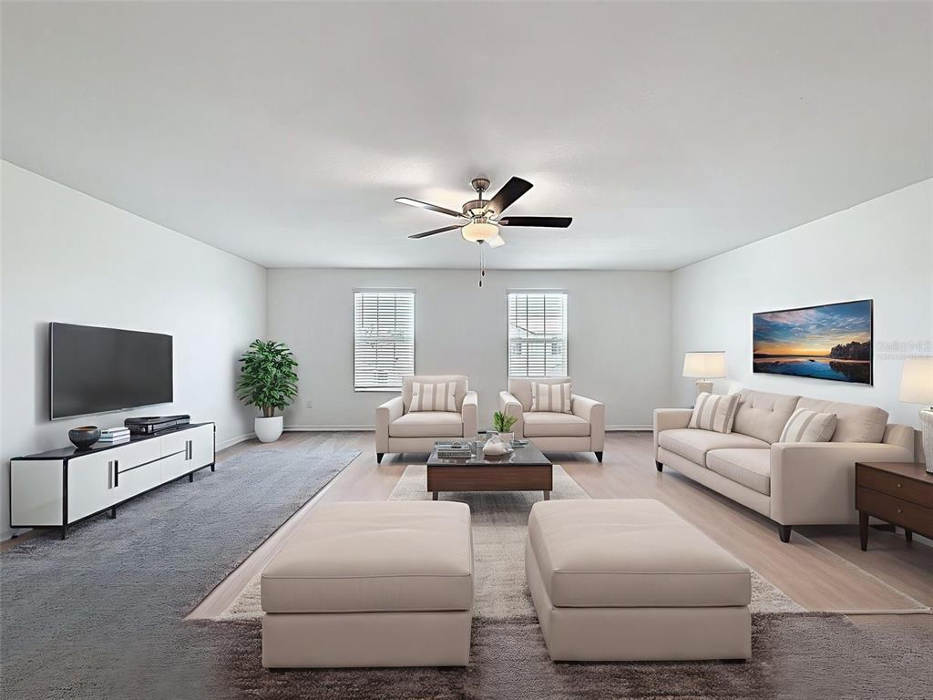 4395 Trotters Way Lakeland, FL 33801 - Photo 32 of 67 a living room with furniture and a flat screen tv
