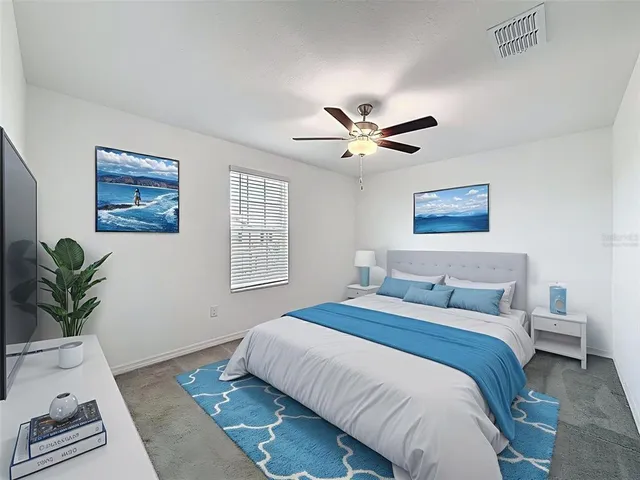 a workspace with a bookshelf and a window