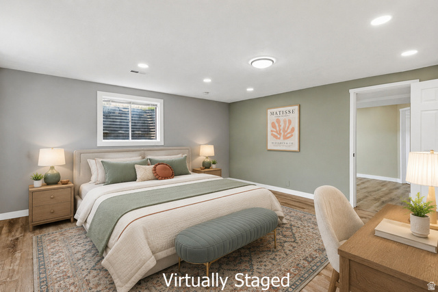 2693 Teal Way Sandy, UT 84093 - Photo 31 of 50 Bedroom featuring wood-finish flooring, recessed lighting, a white trim window, and a paneled interior door
