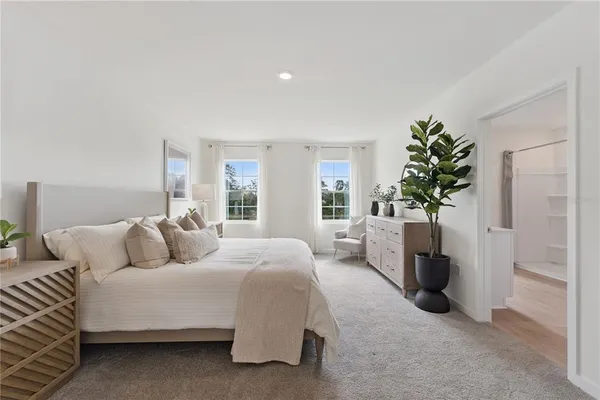 a bedroom with a bed and a sink