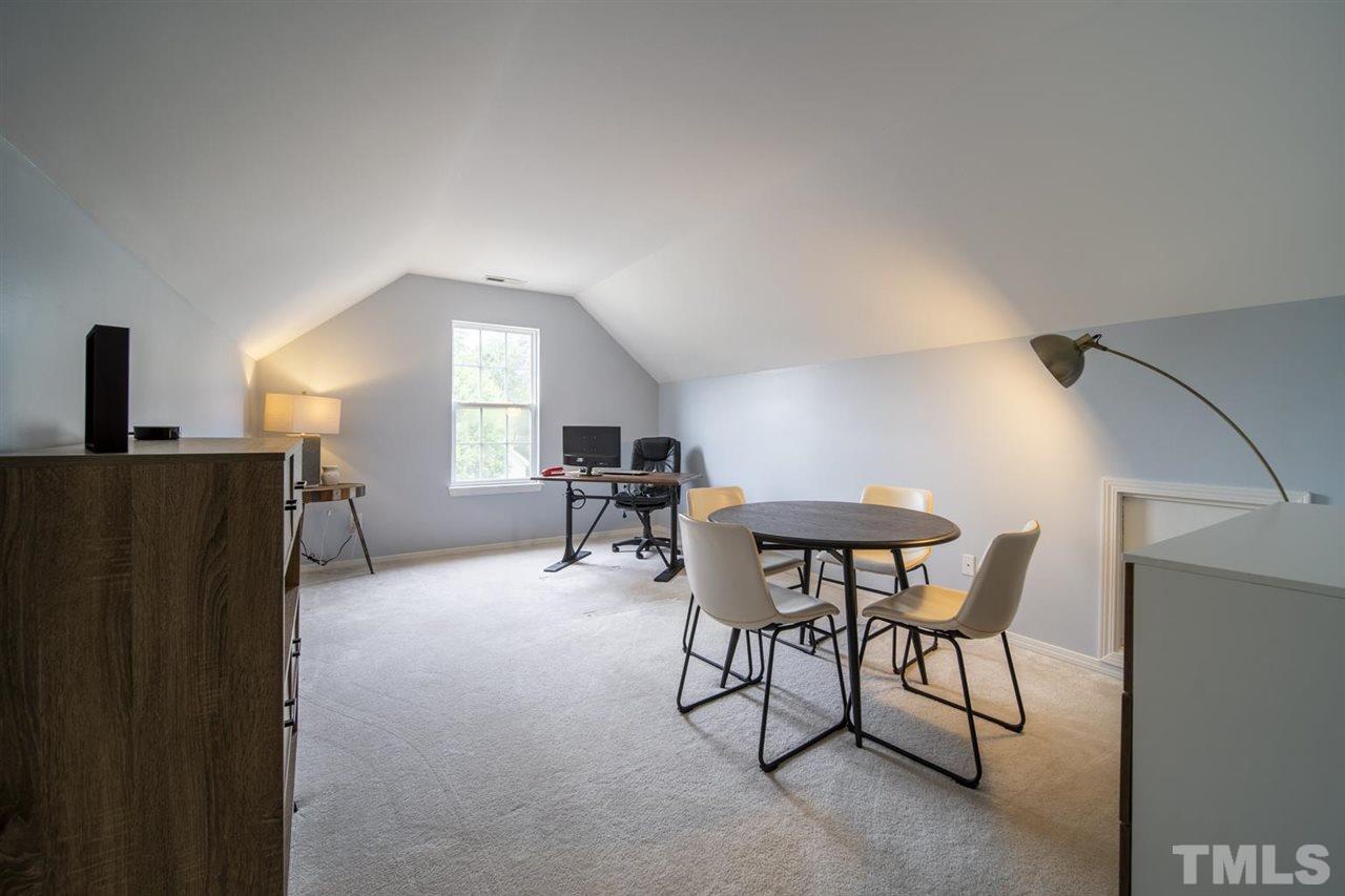 4817 Mistletoe Lane Durham, NC 27703 - Photo 14 of 15 a view of a livingroom with furniture and a window
