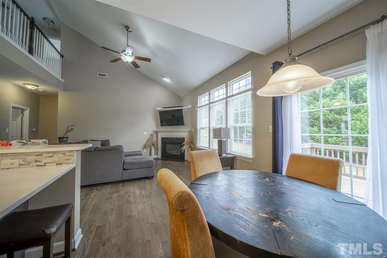 4817 Mistletoe Lane Durham, NC 27703 - Photo 8 of 15 a large kitchen with kitchen island a large island in it