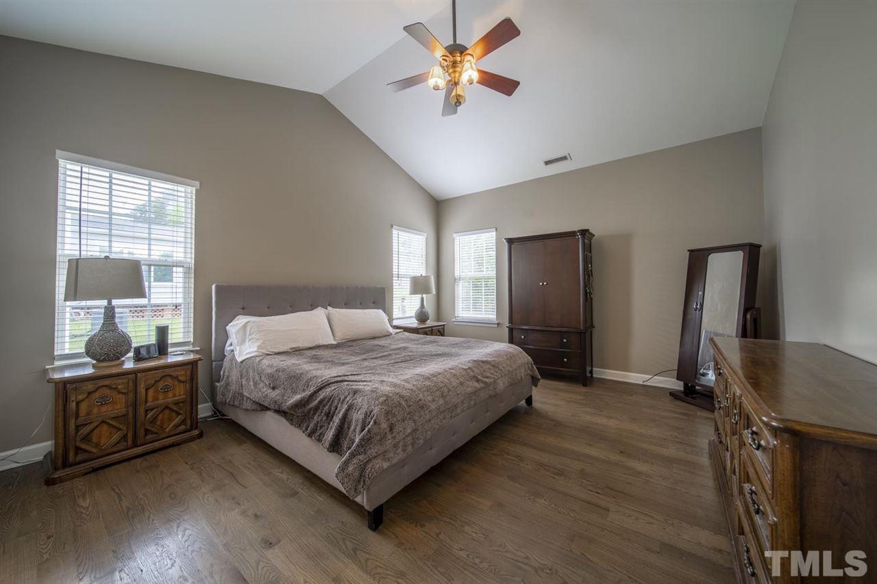 4817 Mistletoe Lane Durham, NC 27703 - Photo 10 of 15 a bedroom with a bed furniture and a window