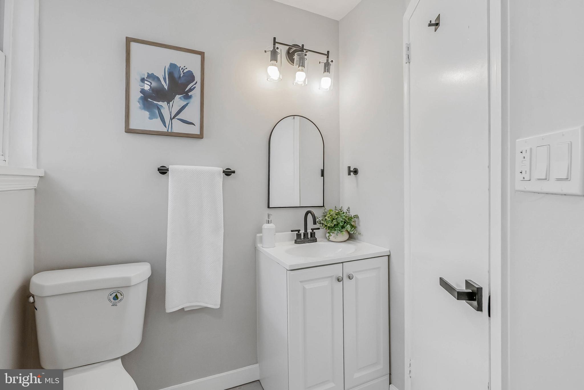 2839 Winton Street Philadelphia, PA 19145 - Photo 16 of 20 a bathroom with a sink and a mirror