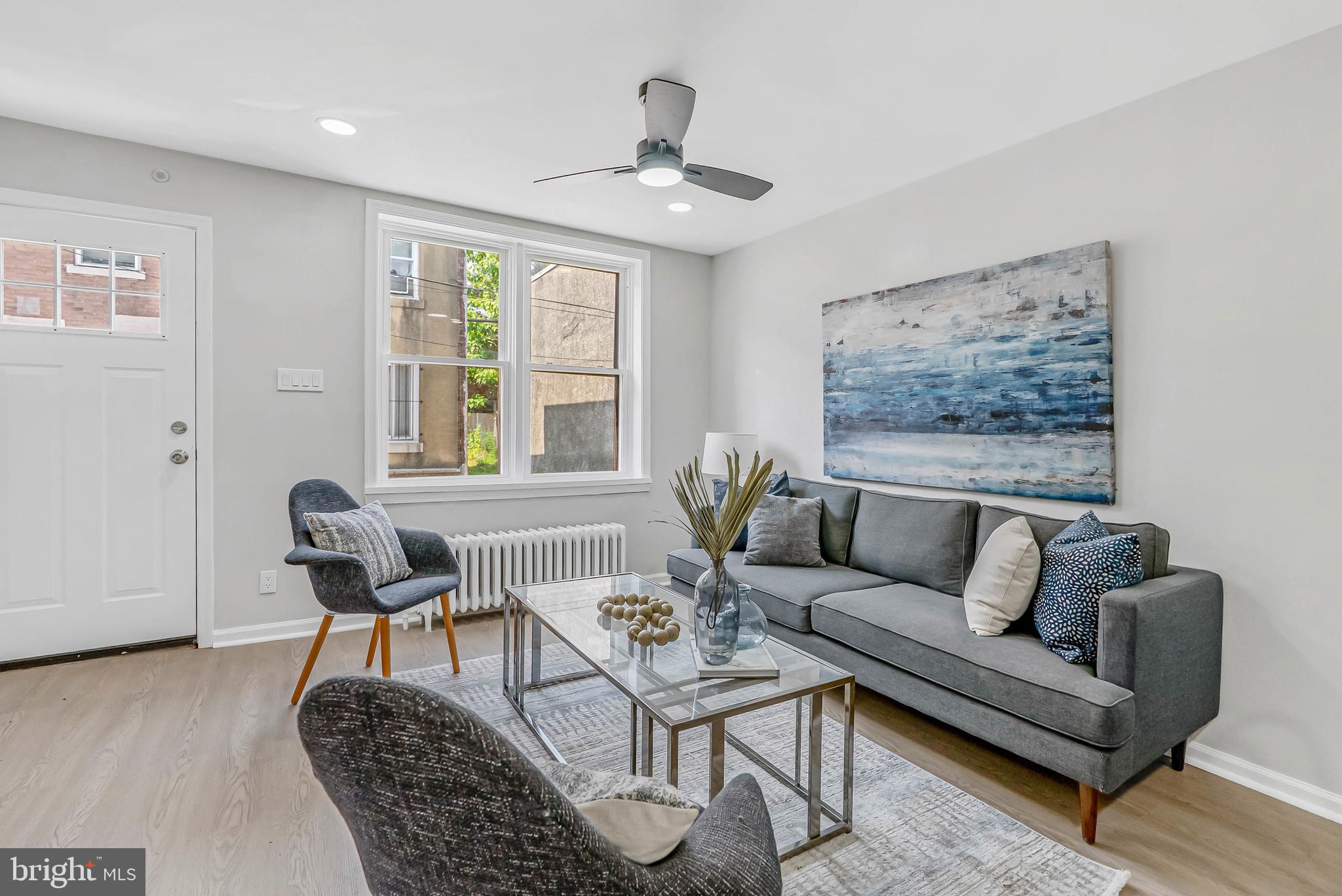 2839 Winton Street Philadelphia, PA 19145 - Photo 3 of 20 a living room with furniture a window and a potted plant