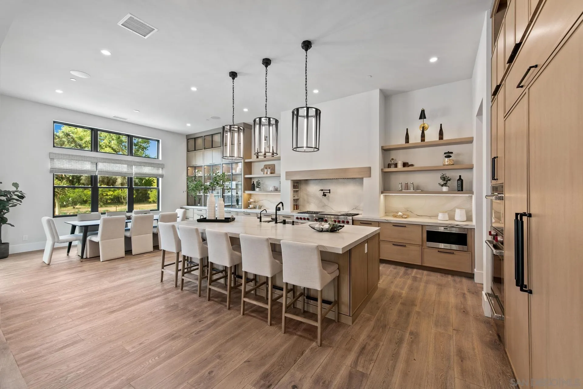 16073 Via Monte Rancho Santa Fe, CA 92067 - Photo 18 of 62 a large kitchen with a table and chairs in it