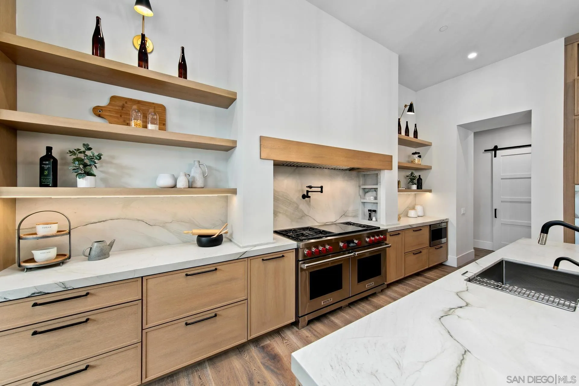 16073 Via Monte Rancho Santa Fe, CA 92067 - Photo 23 of 62 a kitchen with sink a stove and cabinets