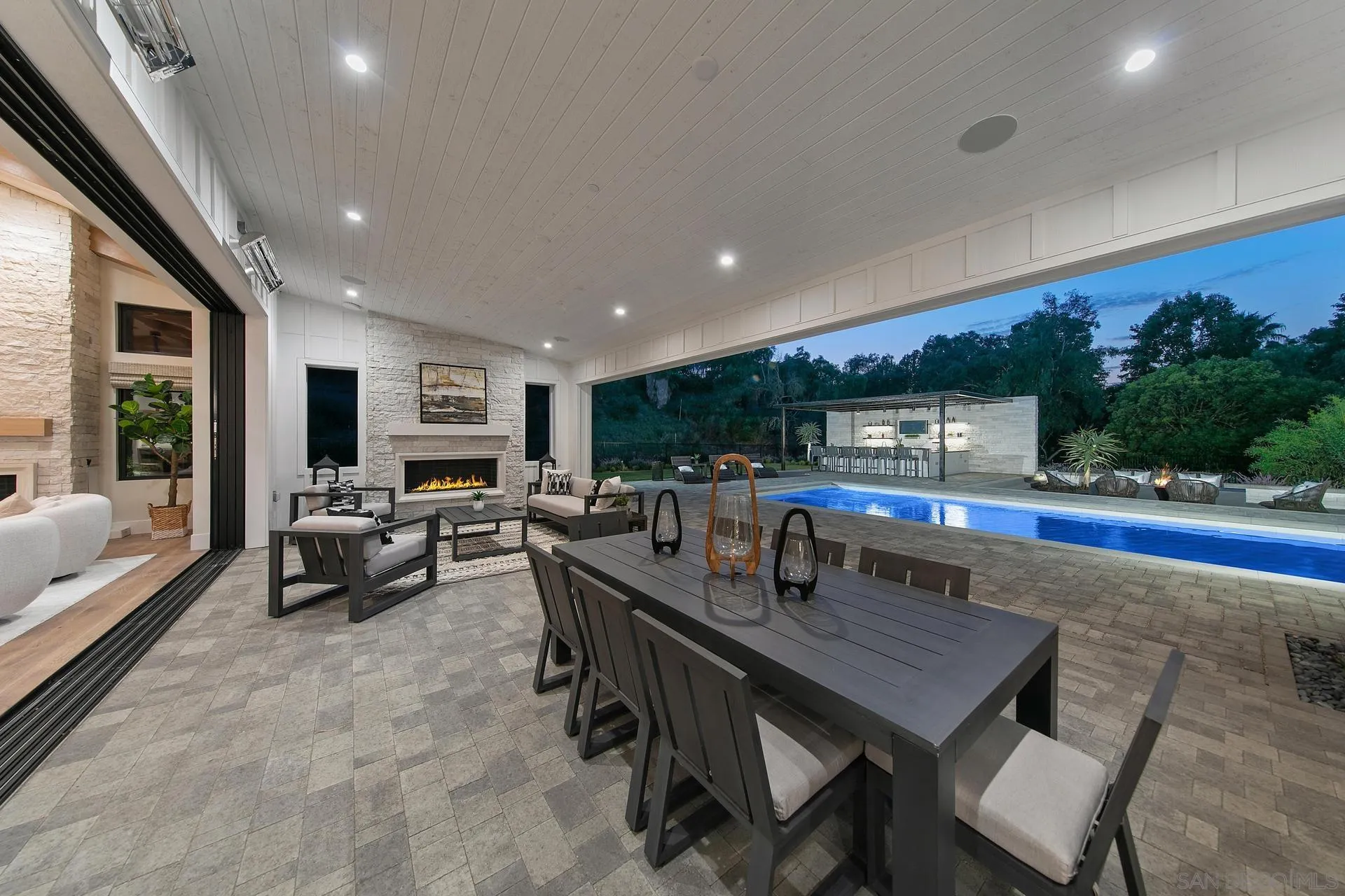 16073 Via Monte Rancho Santa Fe, CA 92067 - Photo 31 of 62 a dining hall with furniture a large window and a rug