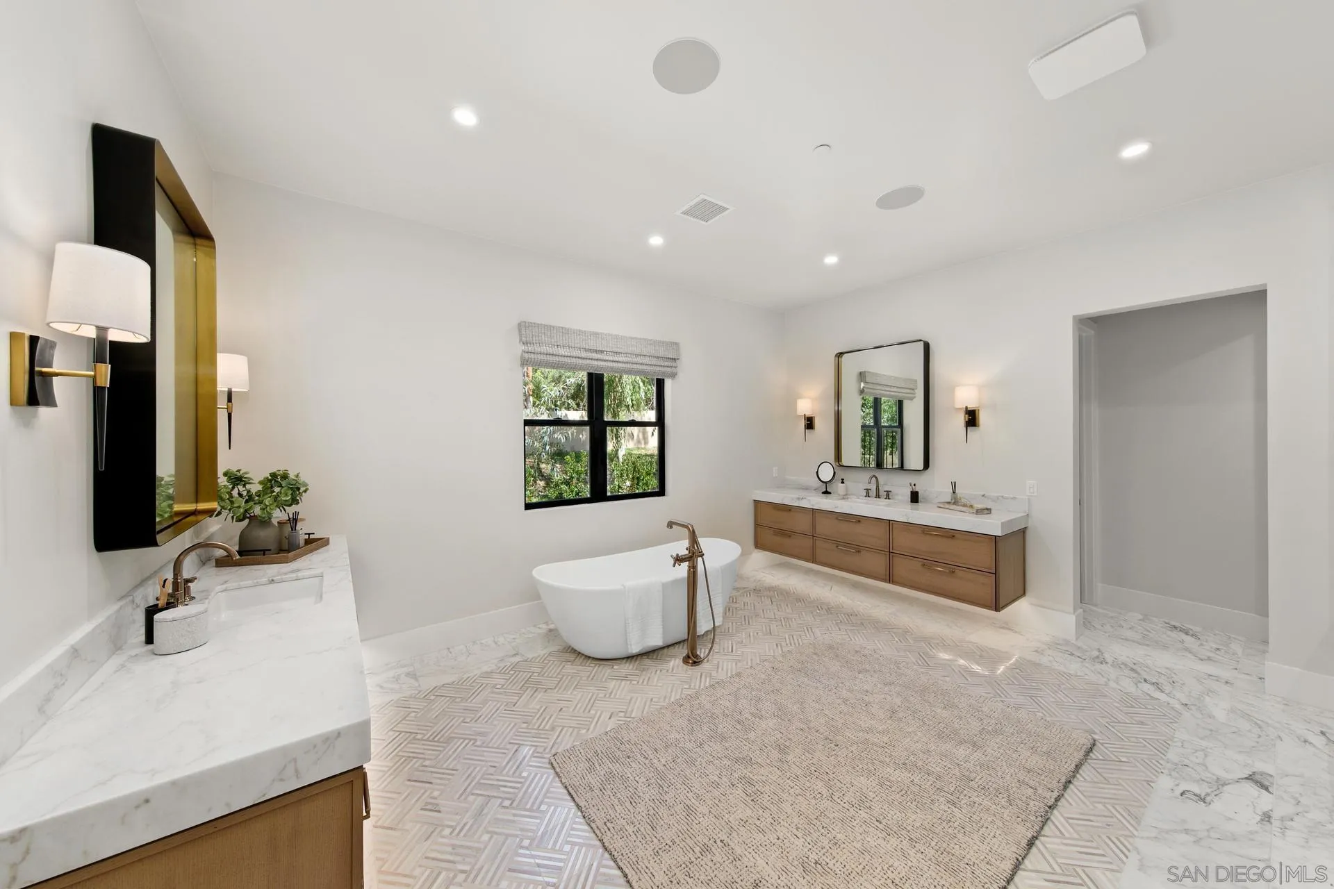 16073 Via Monte Rancho Santa Fe, CA 92067 - Photo 44 of 62 a spacious bathroom with a double vanity sink a mirror and a bathtub