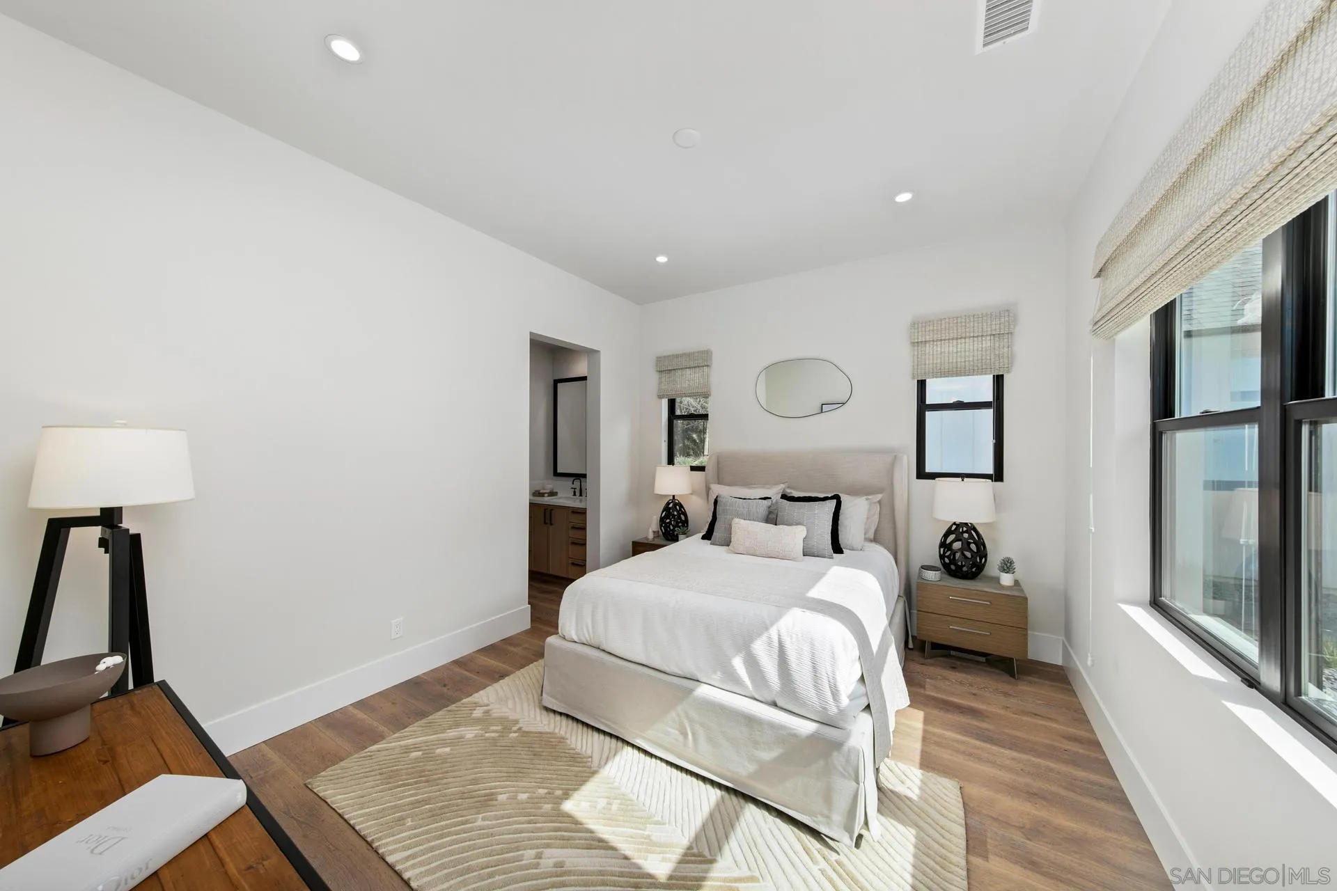 16073 Via Monte Rancho Santa Fe, CA 92067 - Photo 48 of 62 a bedroom with a bed and a lamp