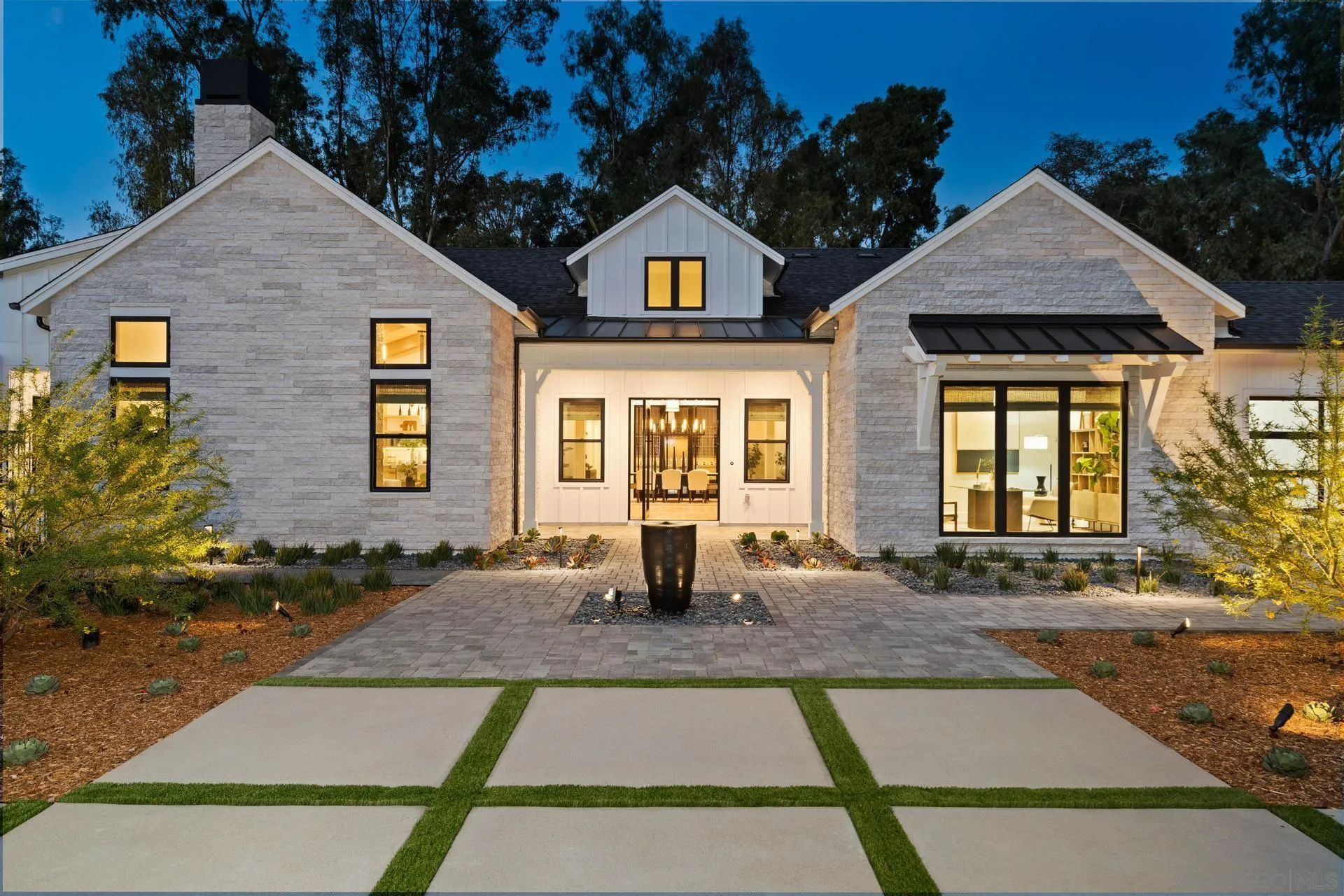 16073 Via Monte Rancho Santa Fe, CA 92067 - Photo 5 of 62 a front view of a house with basket ball court and outdoor seating