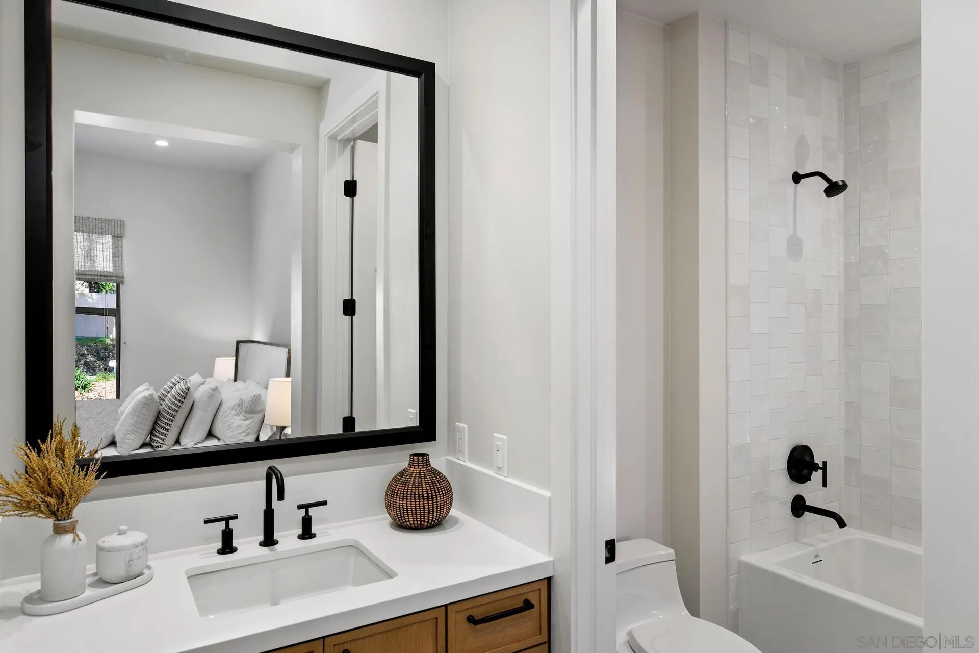 16073 Via Monte Rancho Santa Fe, CA 92067 - Photo 53 of 62 a bathroom with a sink and a mirror