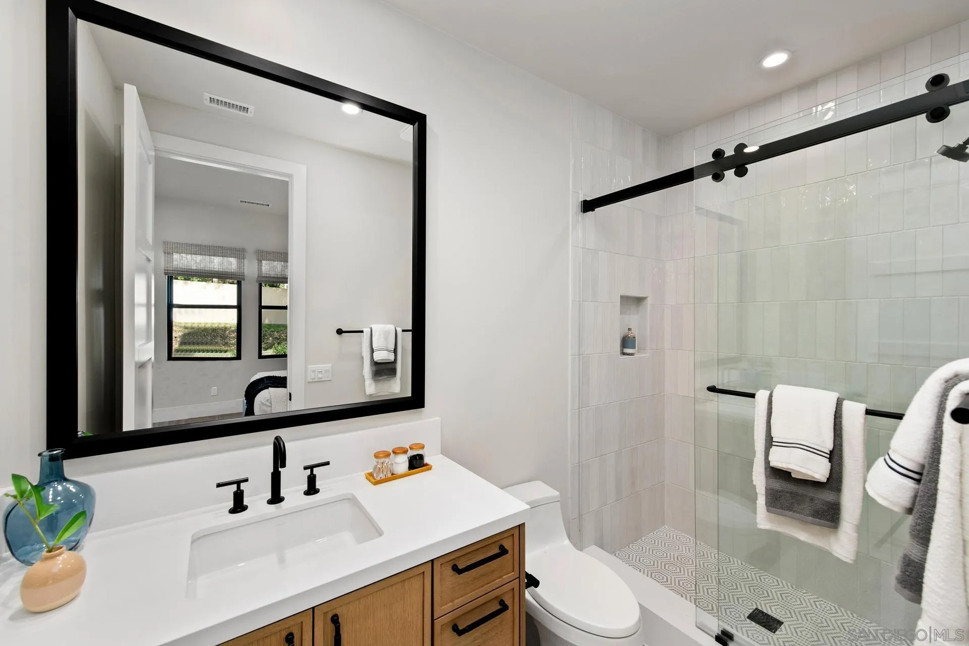 16073 Via Monte Rancho Santa Fe, CA 92067 - Photo 54 of 62 a bathroom with a sink toilet and shower